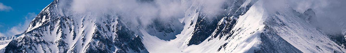 snow and clouds on mountain